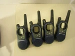 Motorola Walkie Talkies (4) K7GSX900 W/ Adaptor, Base Charger And Belt Clip. Fixed Price $8.37.