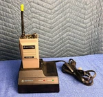 Motorola HT50 Synthesized Portable Radio Model W/ Base Station Charger NTN4864B. Fixed Price $189.99.