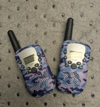 Travel T-388 2-PC Multi Channel Walkie Talkie Set, W/built-in Light, Purple Camo. Fixed Price $14.99.