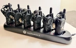 Motorola CLS1410 Walkie Talkies Lot Of 6 W/ Gang Charger, Headsets & Clips. Fixed Price $539.00.