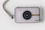 Polaroid Snap POLSP01 Instant Camera W/ Built Printer + Battery. Fixed Price $25.00.